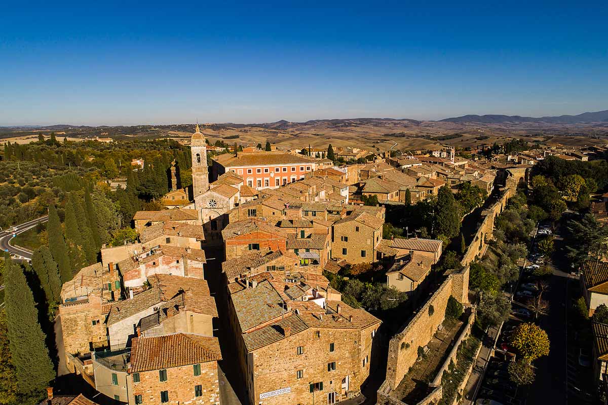 Italy, Tuscany, San Quirico d'Orcia as seen from a drone - Latitudes